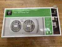 Photo of the Westpointe twin window fan box with product image and details.