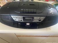 Front view of Panasonic boombox showing cassette and radio control panel and speakers.