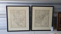 Two framed vintage maps of North America, side by side, both 22x22 inches
