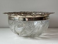 Side profile of the serving bowl showing cut crystal base with silver rim on top