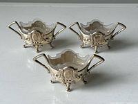 Three salt cellars arranged together showing overall set