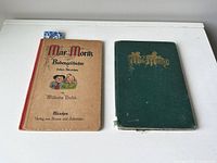 Pair of books laid on a white surface; left German paperback with tan cover and illustration, right green hardcover English edition book with gold embossed title.