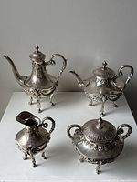 Overview of four-piece set on white surface