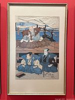 Framed Japanese woodblock print showing full artwork, featuring three samurai figures seated inside with swords in the background, framed in a simple thin frame with glass.