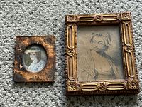 Overview of both framed artworks on carpet background showing the miniature portrait painting on the left and the etching on the right.