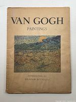 Front cover of the folio-sized art book showing aged, stained, and worn cover with Van Gogh painting print.