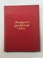 Front cover of the red hardcover book with gold embossed title text.