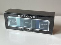 Photo of the sealed Bulgari Aqva Pour Homme Travel Collection box showing three small fragrance bottles labeled Marin, Pour Homme, and Atlantique with size 15ml each.