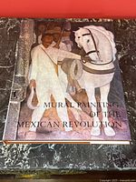 Front cover showing artwork and title 'Mural Painting of the Mexican Revolution'.