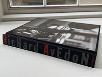 Closed view of the hardcover book showing the spine with 'Richard Avedon' in bold letters and a grayscale portrait on the front cover.