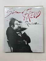 Front cover of the hardcover book showing ink illustration of Sigmund Freud and artist's signature.