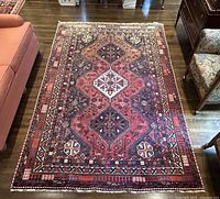 Full top-down view of rug in room showing overall design, color, and size.