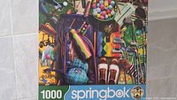 Front of Springbok puzzle box showing golf themed image and 1000 piece count