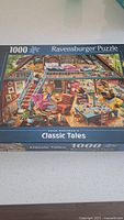 Front view of sealed Ravensburger 1000-piece puzzle box