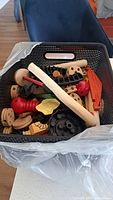 Basket view showing mixed wooden blocks, wheels and connectors