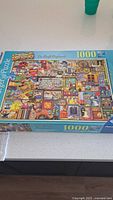 Front of Ravensburger Curious Cupboards No. 2 1000-piece puzzle box