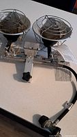 Top view of dual radiant propane heater showing burners, mounting bracket and hose