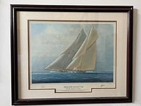 Overall view of framed print showing two schooners racing on the ocean