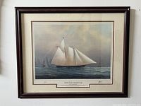 Full frontal view of the framed print showing frame, mat, and artwork in its entirety.