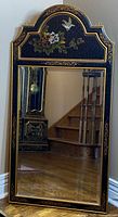 Full view of arched-top black chinoiserie mirror showing overall design and size