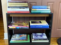 Entire lot on bookshelf showing all volumes