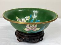 Top angled view of green cloisonné bowl on stand
