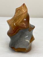 Front view of multicolour jasper flame sculpture