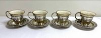 All four assembled demitasse sets