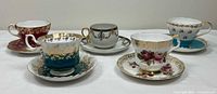 Group shot of five teacup and saucer sets