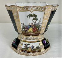 Front view of assembled vase showing courting couple scene and gilded decoration