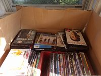 Cardboard box filled with DVD cases