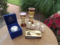 Overview of tealight holder in box, two drip glaze candlesticks, four FALL votives, boxed snuffer