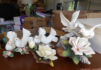 Group shot of all four porcelain figurines