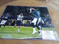 Signed Nick Foles photograph showing action play versus Patriots