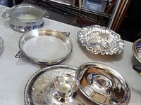 Group of silver-plate trays, carriers and Pyrex inserts