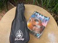 Gig bag and song book on table