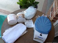 Overview showing Conair paraffin bath, two glycerine hand therapy tubs, liners, mitts, manual