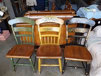 Three Hitchcock chairs grouped