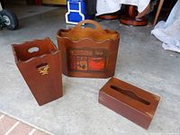 All three wooden items – trash can, magazine rack, tissue box