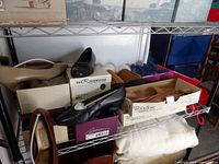 Shoes, slippers, sneaker boxes, boot shapers and Woodlore shoe tree box on shelving