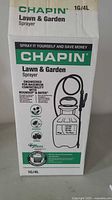 Box of Chapin Lawn & Garden Sprayer showing product branding, 1G/4L capacity, and usage info.