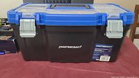 Closed view of the blue and black Mastercraft toolbox showing top handle and metal latches