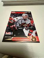 Front of hockey card showing André Roy in Ottawa Senators uniform signed in black marker.