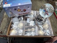 All lot contents: ornament box, snow globe, retail box