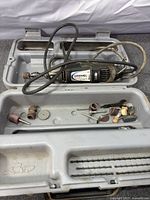 Dremel tool in open case with accessories