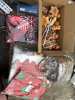 Overall view of ornaments, fabric décor packs, treat bags and wicker basket