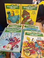 Front covers of several volumes showing titles 3, 6, 5 and 7