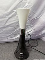 Front view of OttLite table lamp with cord and power switch