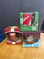 Front view of three boxed Tim Hortons mugs stacked
