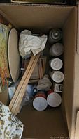 Overview of box with palette, rulers, frames, paint cylinders